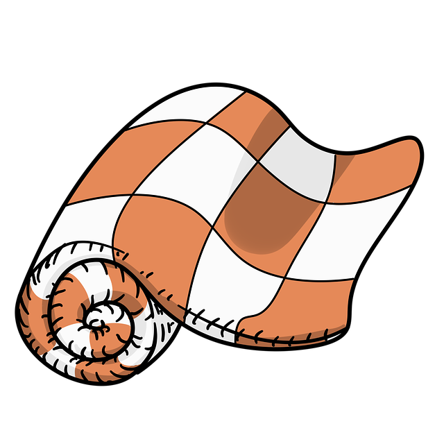 肌掛け布団の洗濯表示を確認する手元